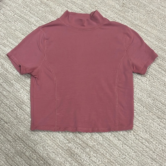 Cropped turtle neck top with contoured stitching. - Picture 1 of 3